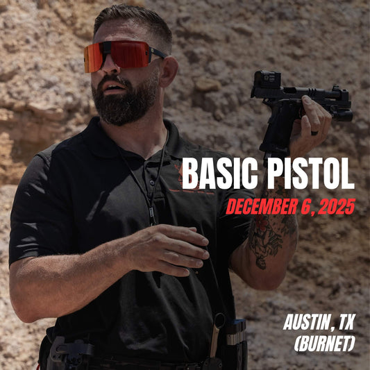 Tactical instructor teaching fundamentals of pistol handling during Basic Pistol course in Burnet, Texas