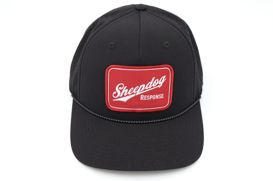 Front view of black Sheepdog Lite Patch Hat with red embroidered Sheepdog Response patch and braided rope across bill