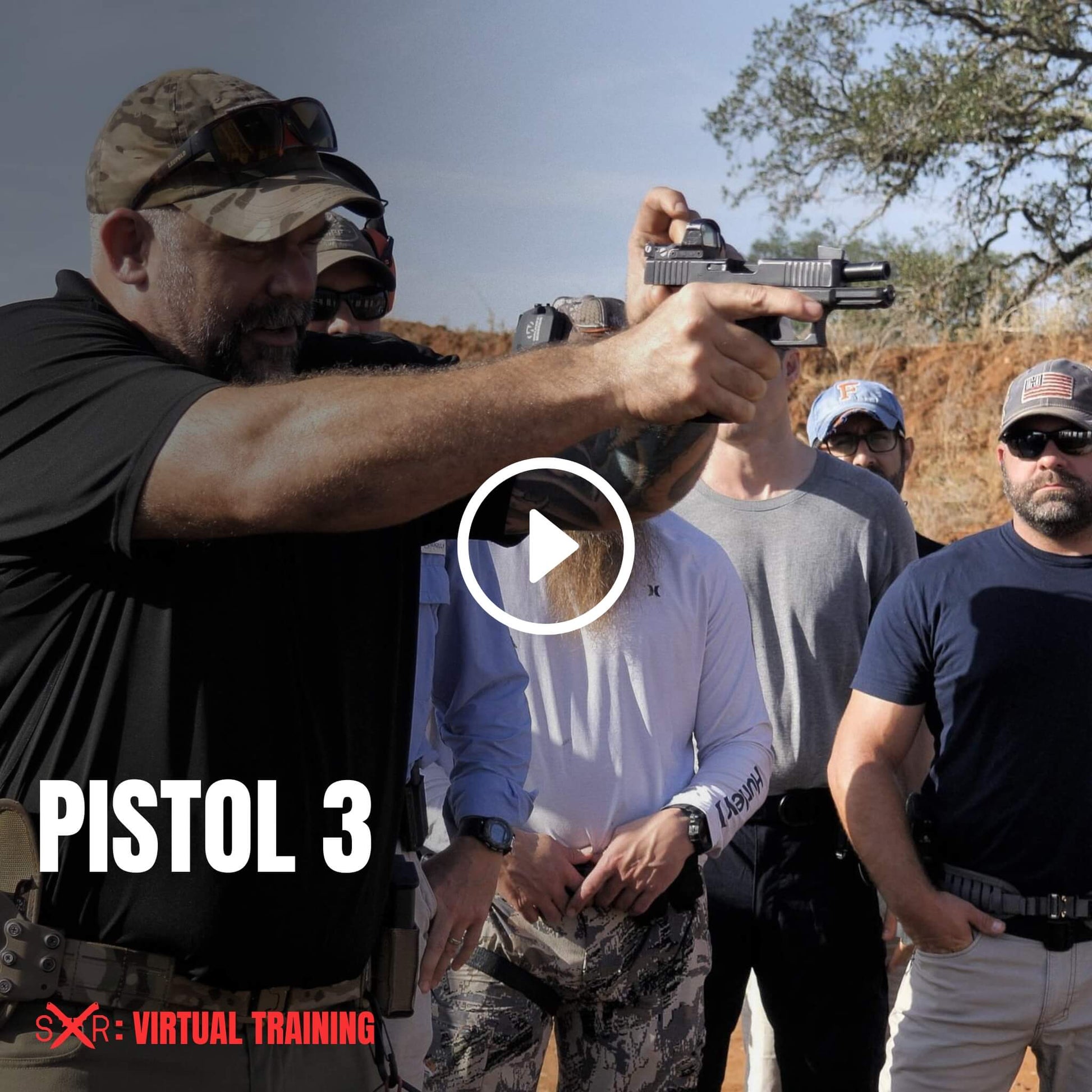 Advanced pistol course instructor demonstrating live fire techniques to a group of engaged students in virtual training