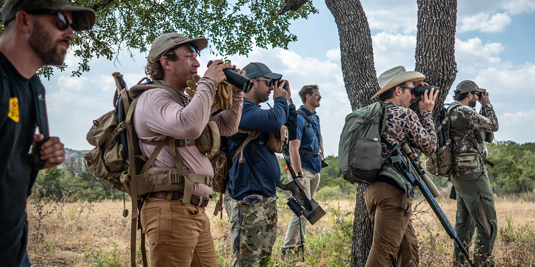 Provider Course photo of Tim Kennedy and Class attendants looking through binoculars to spot an animal 