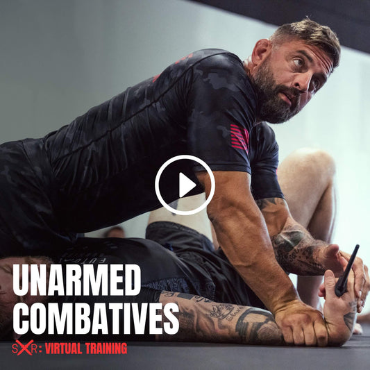 Instructor demonstrating dominant ground control and weapon retention in the Unarmed Combatives virtual course